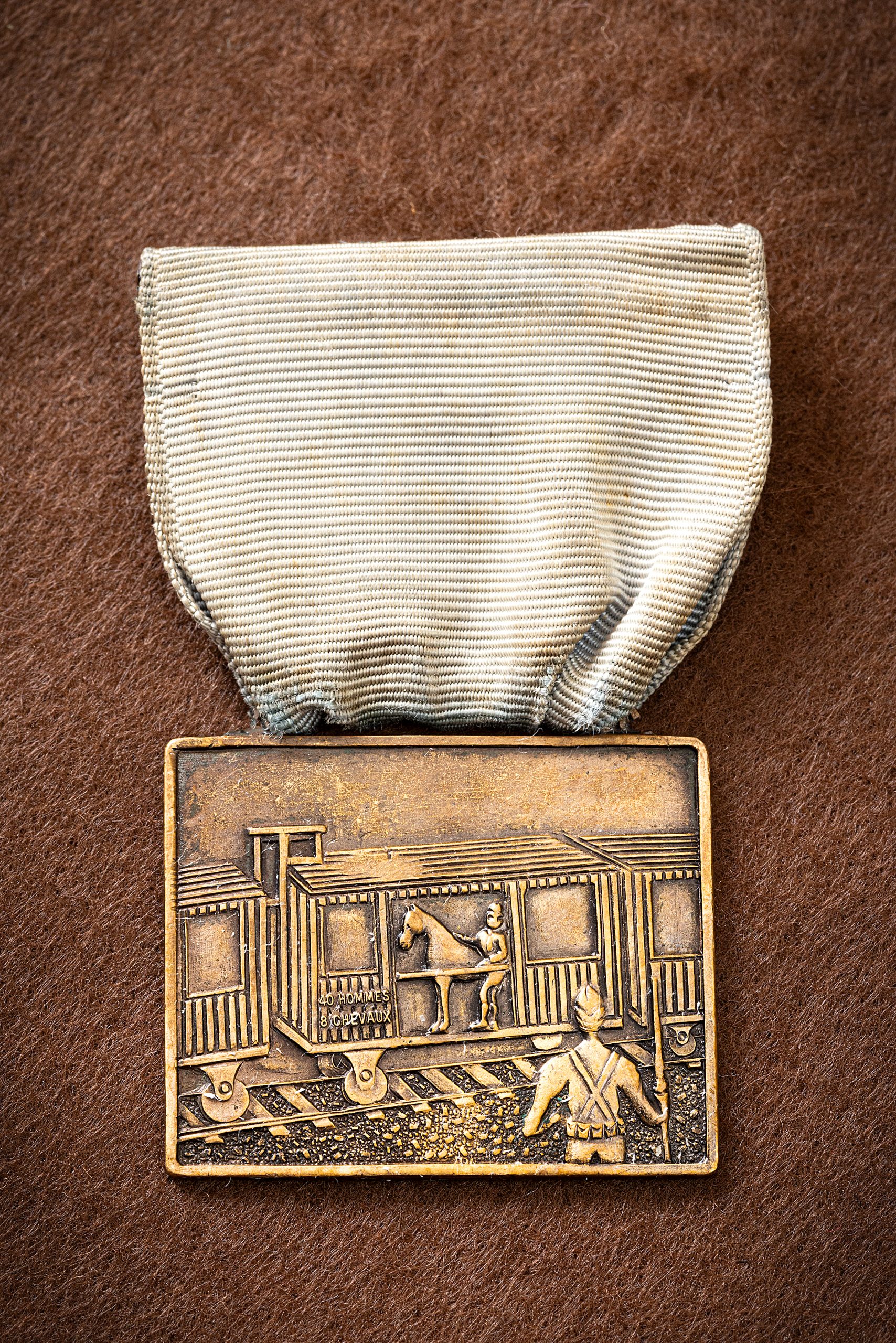 The “Forty and Eight” Club name comes from the railroad cars used in France during World War I 
to transport American soldiers to the western front; they could hold 40 men or eight horses. Every member was proud to own this medal.