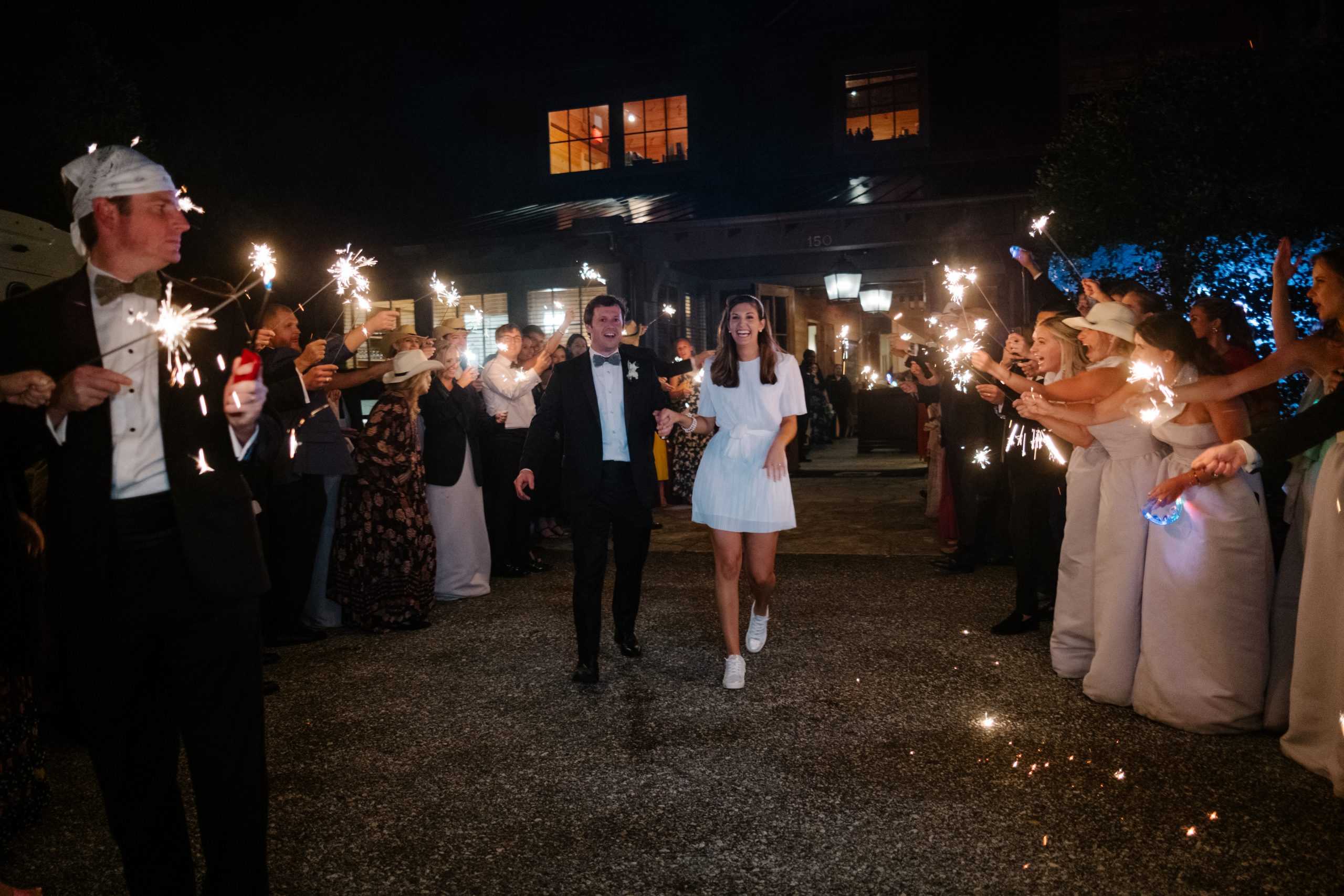 After all the dancing, Paige found tennis shoes a chic-comfy option as they left amid a sea of sparklers.
