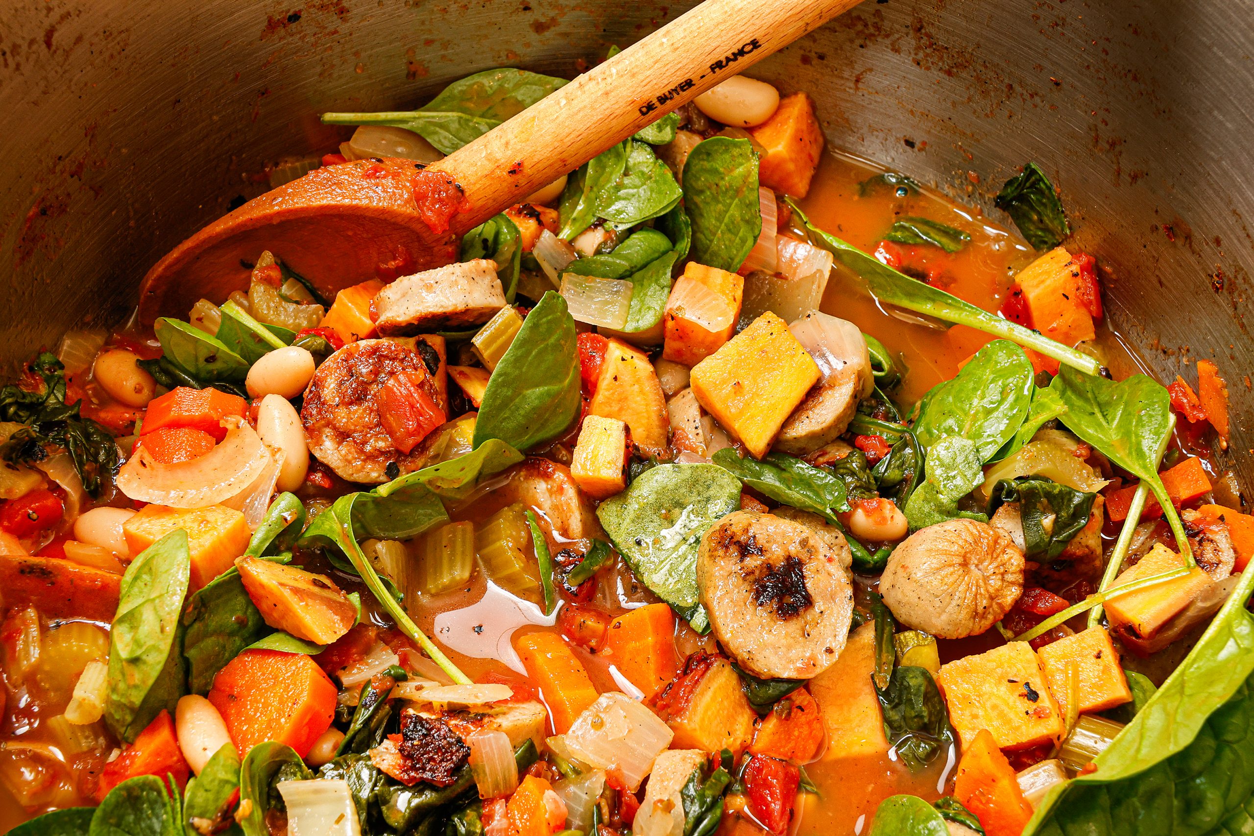 Sweet Potato Minestrone is packed with nutritious vegetables — the perfect meal to deliver in a basket with crusty bread and butter and salad. Soup can be eaten immediately or frozen. Jacquard Francais tea towel courtesy of Kudzu Bakery & Market.
