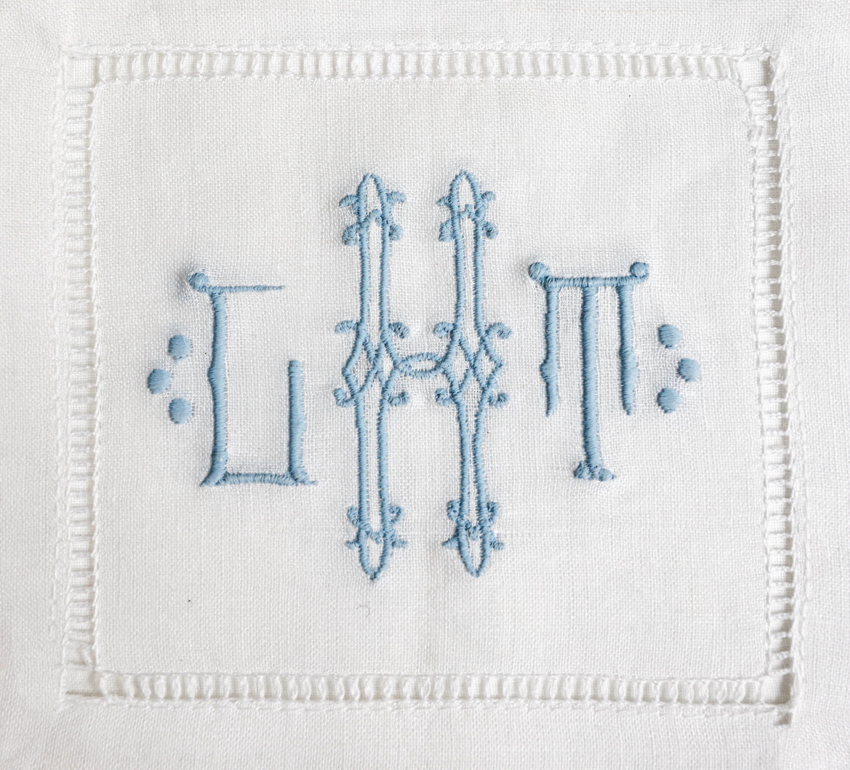 Caroline Matthews, the seamstress behind Duke and Duchess Monograms, employs the use of a home embroidery machine to create timeless designs in a fraction of the time it takes to produce a hand embroidered equivalent. Caroline describes the preliminary design selection as extremely personal as a lot of steps are involved in finding the right monogram. While Caroline carries a small collection of ready-to-embroider goods, she also allows clients to bring their own pieces.
