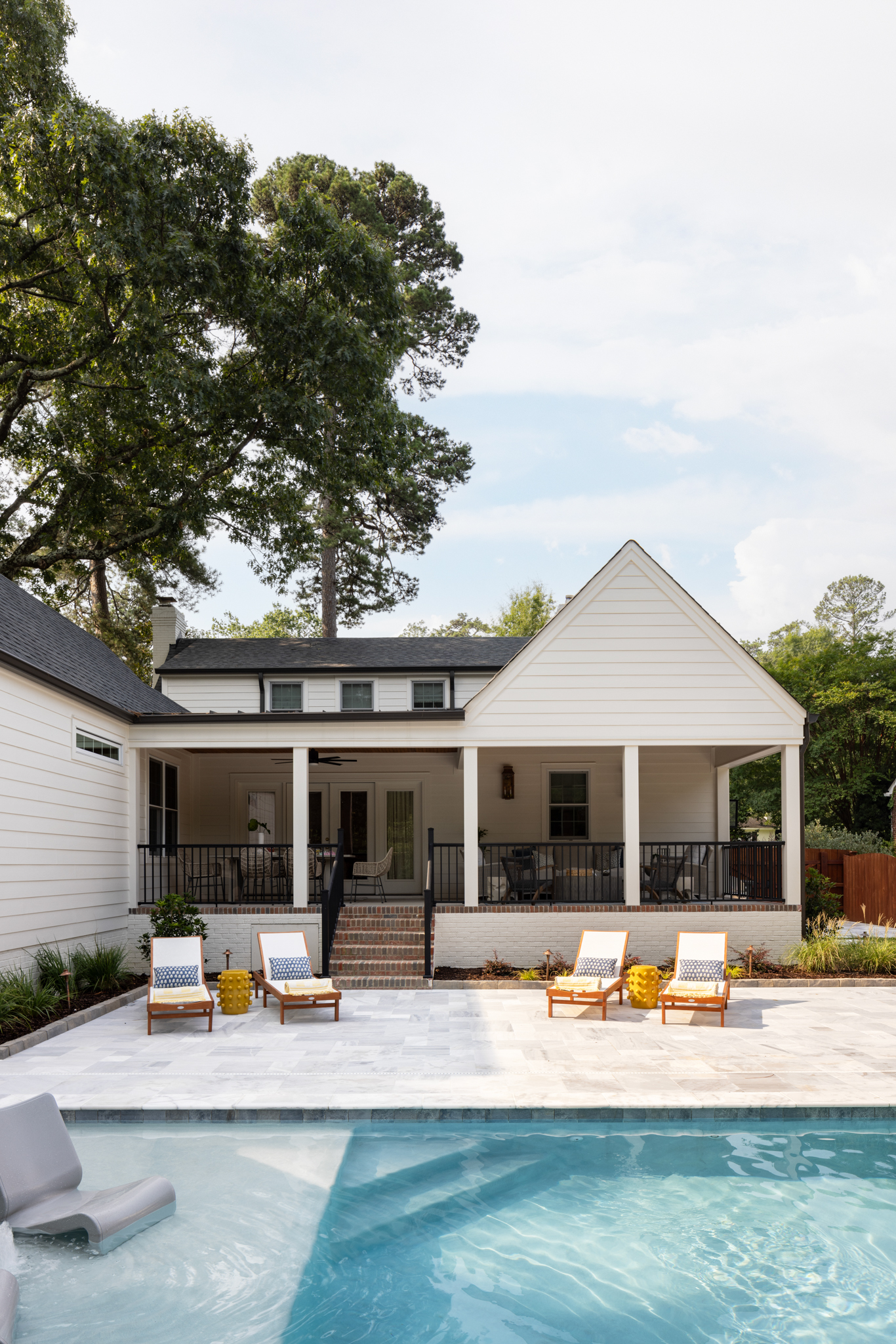 One of the most dramatic additions to the property is the sleek backyard pool. Because of the small space, Lucie sought a change that would be proportional, wanting the pool to feel cool and tailored while not overpowering the small backyard. 